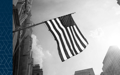 American flag flies over city